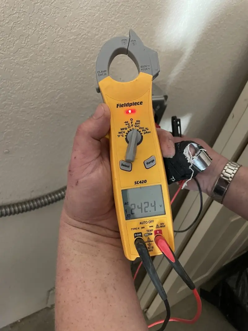 Voltage testing with clamp meter during Electrical Installation Services in Fishers